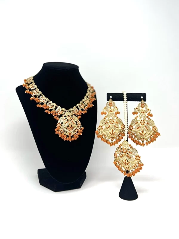 orange jadau tikka set